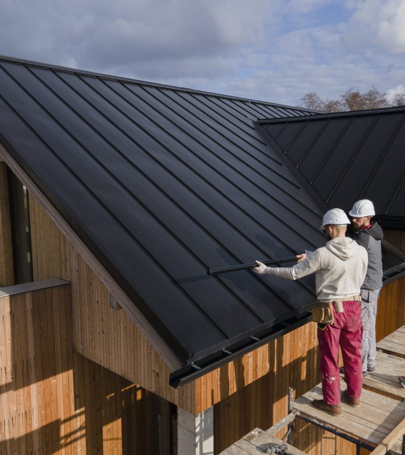 full-shot-roofers-working-together-with-helmets-scaled-1.jpg